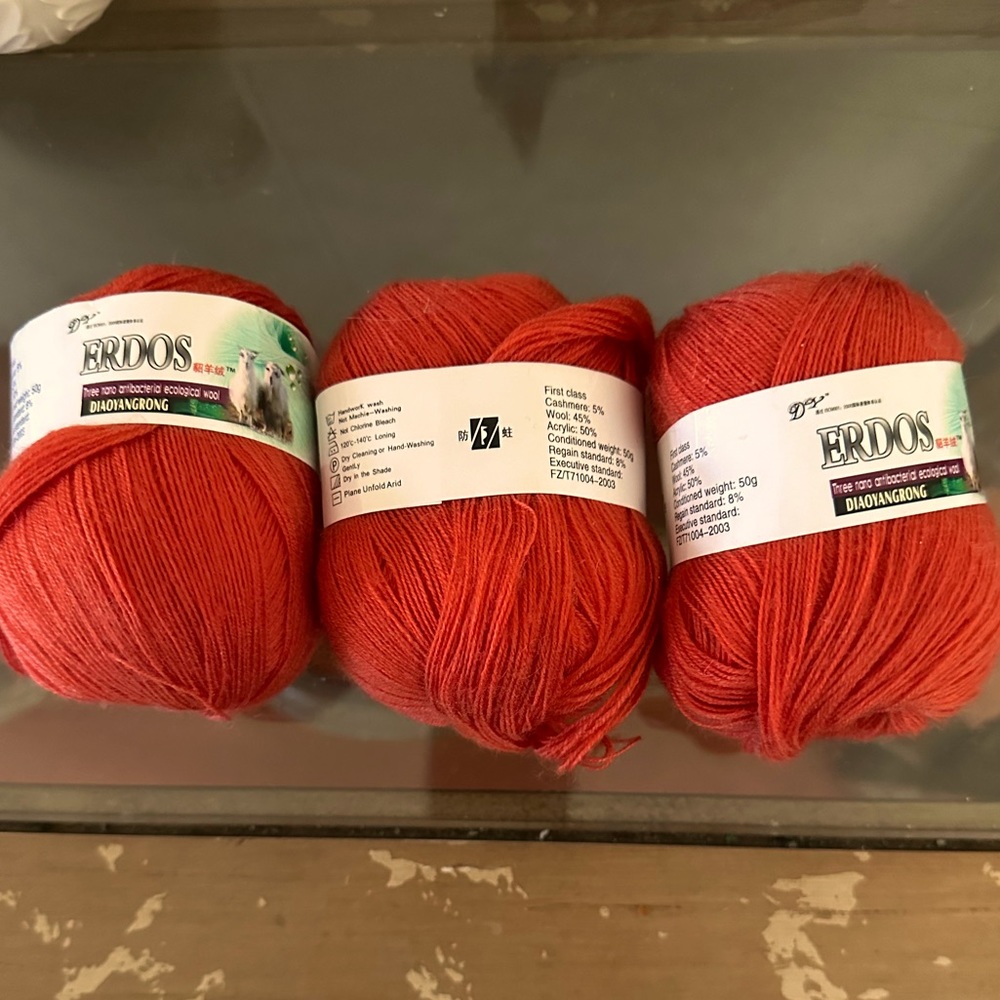 Fine yarn, size 1, small burnt orange color.  3 rounds, soft texture. NWOT